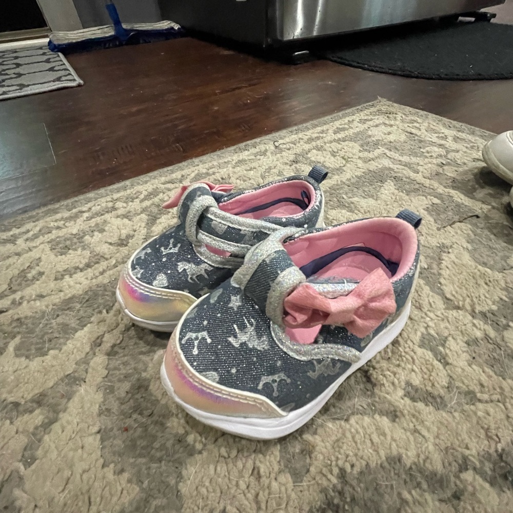In the first picture never worn strap on shoes, other two are stride rites